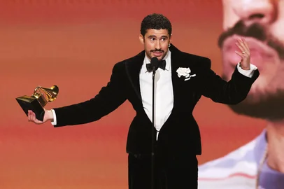 LOS ANGELES, CALIFORNIA - FEBRUARY 01: Bad Bunny accepts the Album of the Year award for "DeBÍ TiRAR MáS FOToS" onstage during the 68th GRAMMY Awards at Crypto.com Arena on February 01, 2026 in Los Angeles, California.   Kevin Winter/Getty Images for The Recording Academy/AFP (Photo by KEVIN WINTER / GETTY IMAGES NORTH AMERICA / Getty Images via AFP)<!-- NICAID(16216770) -->