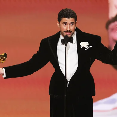 LOS ANGELES, CALIFORNIA - FEBRUARY 01: Bad Bunny accepts the Album of the Year award for "DeBÍ TiRAR MáS FOToS" onstage during the 68th GRAMMY Awards at Crypto.com Arena on February 01, 2026 in Los Angeles, California.   Kevin Winter/Getty Images for The Recording Academy/AFP (Photo by KEVIN WINTER / GETTY IMAGES NORTH AMERICA / Getty Images via AFP)<!-- NICAID(16216770) -->