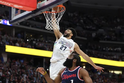 DENVER, COLORADO - APRIL 29: Jamal Murray #27 of the Denver Nuggets dunks over James Harden #1 of the LA Clippers during the first quarter in Game Five of the Western Conference First Round NBA Playoffs at Ball Arena on April 29, 2025 in Denver, Colorado. NOTE TO USER: User expressly acknowledges and agrees that, by downloading and or using this photograph, User is consenting to the terms and conditions of the Getty Images License Agreement.   Matthew Stockman/Getty Images/AFP (Photo by MATTHEW STOCKMAN / GETTY IMAGES NORTH AMERICA / Getty Images via AFP)<!-- NICAID(16027255) -->