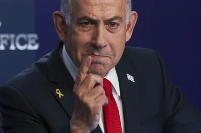 Israeli Prime Minister Benjamin Netanyahu speaks during a press conference in Jerusalem on May 21, 2025. (Photo by Ronen Zvulun / POOL / AFP)<!-- NICAID(16049979) -->