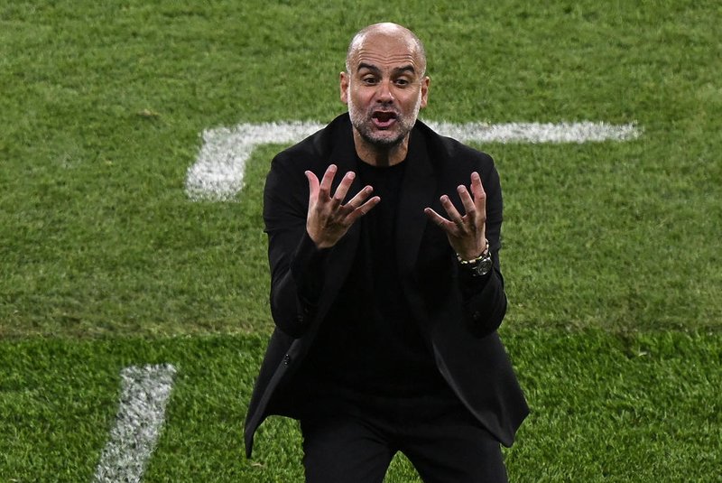 Manchester City's Spanish manager Pep Guardiola reacts during the UEFA Champions League final football match between Inter Milan and Manchester City at the Ataturk Olympic Stadium in Istanbul, on June 10, 2023. (Photo by YASIN AKGUL / AFP)<!-- NICAID(15453006) -->