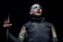 (FILES) In this file photo Marilyn Manson performs during the Astroworld Festival at NRG Stadium on November 9, 2019 in Houston, Texas - "Westworld" star Evan Rachel Wood on February 1, 2021 accused industrial rock icon Marilyn Manson of being a "dangerous man" who subjected her to years of abuse starting when she was a teenager.  The American actress, who began working in entertainment as a child, has in the past alleged abuse by an ex-partner whom she kept anonymous, but on Monday identified her abuser as "Brian Warner, also known to the world as Marilyn Manson." (Photo by SUZANNE CORDEIRO / AFP)<!-- NICAID(14704416) -->