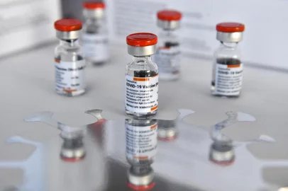 (FILES) In this file photo taken on February 24, 2021 vials of the CoronaVac vaccine, developed by China's Sinovac firm, are displayed in Bangkok as the first batch of vaccines to battle the Covid-19 coronavirus arrive in the kingdom. - The World Health Organization on June 1, 2021 approved the Sinovac Covid-19 vaccine for emergency use -- the second Chinese jab to receive the WHO's green light. (Photo by Lillian SUWANRUMPHA / AFP)<!-- NICAID(14803317) -->