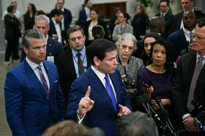 (L/R) US Secretary of Defense Pete Hegseth and US Secretary of State Marco Rubio speak to reporters after they briefed Senators on the recent US military actions in Venezuela, on Capitol Hill in Washington, DC on January 7, 2026. (Photo by Brendan SMIALOWSKI / AFP)<!-- NICAID(16199571) -->