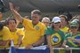 Former Brazilian President Jair Bolsonaro (2019-2022) greets supporters during a rally in Sao Paulo, Brazil, on February 25, 2024, to reject claims he plotted a coup with allies to remain in power after his failed 2022 reelection bid. Investigators say the far-right ex-army captain led a plot to falsely discredit the Brazilian election system and prevent the winner of the vote, leftist President Luiz Inacio Lula da Silva, from taking power. A week after Lula took office on January 1, 2023, thousands of Bolsonaro supporters stormed the presidential palace, Congress and Supreme Court, urging the military to intervene to overturn what they called a stolen election. (Photo by NELSON ALMEIDA / AFP)<!-- NICAID(15689134) -->