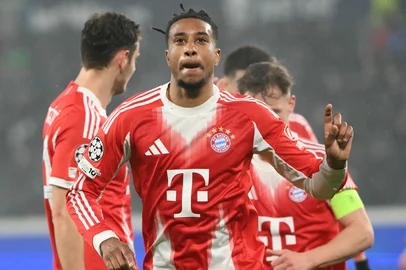 Bayern Munich's French midfielder #17 Michael Olise celebrates scoring his team's fifth goal during the UEFA Champions League last 16, first leg football match between Atalanta and Bayern Munich at the Gewiss stadium in Bergamo, on March 10, 2026. (Photo by Alberto PIZZOLI / AFP)<!-- NICAID(16242205) -->