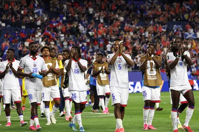 Haiti players acknowledge the crowd after losing the 2026 World Cup Group C football match between Haiti and Scotland at the Boston Stadium in Foxborough on June 13, 2026. (Photo by FRANCK FIFE / AFP)<!-- NICAID(16306286) -->
