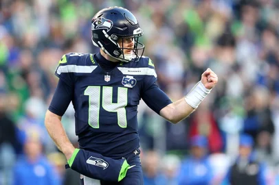 SEATTLE, WASHINGTON - JANUARY 25: Sam Darnold #14 of the Seattle Seahawks celebrates a first quarter touchdown against the Los Angeles Rams in the NFC Championship game at Lumen Field on January 25, 2026 in Seattle, Washington.   Steph Chambers/Getty Images/AFP (Photo by Steph Chambers / GETTY IMAGES NORTH AMERICA / Getty Images via AFP)<!-- NICAID(16211961) -->