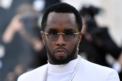 (FILES) Sean Combs 'P. Diddy' arrives for the 2018 Met Gala on May 7, 2018, at the Metropolitan Museum of Art in New York. Music mogul Sean Combs is set to go on trial for racketeering and sex trafficking on May 5, 2025, a judge said in a court hearing October 10, 2024. The rapper known as "Diddy" will remain incarcerated, said federal judge Arun Subramanian, after he was indicted last month on three criminal counts that allege he sexually abused women and coerced them into drug-fueled sex parties using threats and violence. (Photo by ANGELA WEISS / AFP)<!-- NICAID(15891523) -->