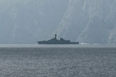 A navy vessel is seen sailing in the Strait of Hormuz, a vital waterway through which much of the world's oil and gas passes on March 1, 2026. Two ships were attacked in the Strait of Hormuz on March 1, maritime security agencies said, as Iran pressed a second day of strikes in response to US-Israeli military strikes on Iran killing it's supreme leader. (Photo by Sahar AL ATTAR / AFP)<!-- NICAID(16236644) -->