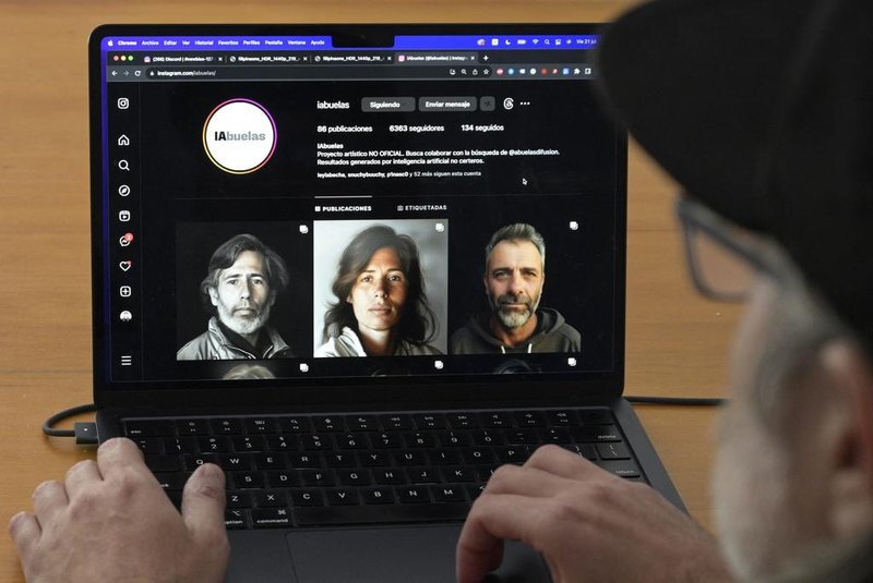 Argentine art designer Santiago Barros shows the Instagram account displaying pictures created with an AI program using file portraits from the Abuelas de Plaza de Mayo photo bank of couples disappeared during the dictatorship (1976-1983) to recreate what the still missing grandchildren might look like today, at his home in Buenos Aires on July 21, 2023. With the idea of "filling a gap" due to a lack of images but without scientific pretension, Santiago Barros came up with the idea of using artificial intelligence to promote and encourage the search for babies stolen during the dictatorship based on photos of their missing parents. (Photo by JUAN MABROMATA / AFP)<!-- NICAID(15490032) -->