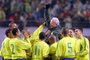 (FILES) Brazilian players cheer to their head coach Mario Zagallo,  after his winning of 100 times A-Matcht, at the end of heir friendly match with South Korea in Seoul on 20 November 2002. Brazilian football legend and four-time world champion Mario Zagallo died January 5, 2024 at the age of 92, a statement on his official Instagram account said. (Photo by KIM JAE-HWAN / AFP)<!-- NICAID(15643388) -->