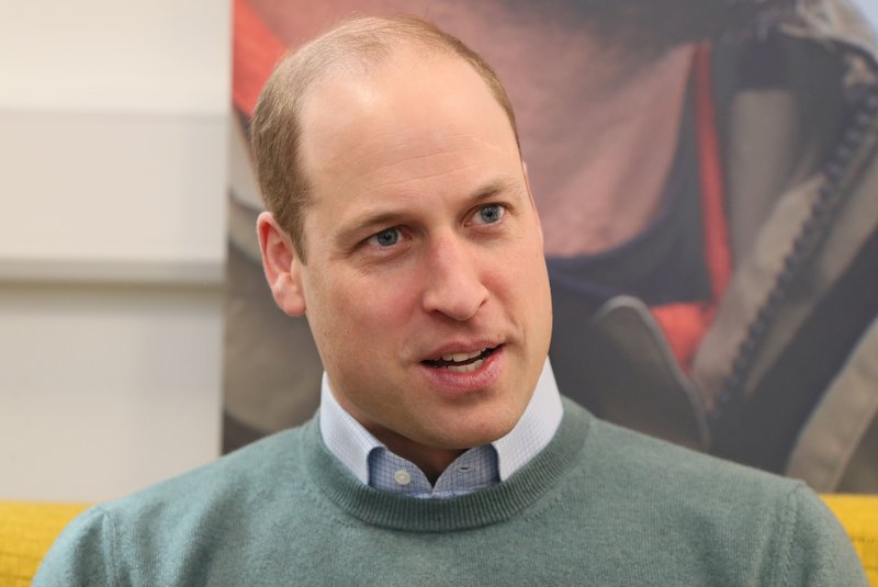 (FILES) In this file photo taken on March 04, 2020 Britain's Prince William, Duke of Cambridge, talks with campaigners, teachers parents of young people who've been supported and coaches during a visit Jigsaw, the National Centre for Youth Mental Health, in Dublin on the second day of their three day visit. - Britain's Prince William on Friday revealed his concern for his father Prince Charles after he contracted coronavirus -- and his worries for his grandmother Queen Elizabeth II. (Photo by Brian Lawless / POOL / AFP)