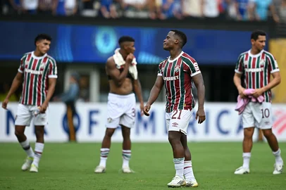 Fluminense's Colombian midfielder #21 Jhon Arias (2nd-R) reacts after losing the FIFA Club World Cup 2025 semifinal football match between Brazil's Fluminense and England's Chelsea at the MetLife stadium in East Rutherford, New Jersey on July 8, 2025. (Photo by Paul ELLIS / AFP)<!-- NICAID(16076044) -->