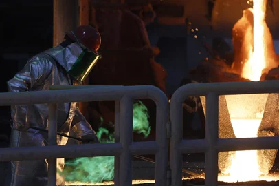 (FILES) A miner melts copper at El Teniente mine, the world's largest underground copper mine in Machali, near Rancagua, Chile on April 2, 2025. Chile, the world's biggest copper producer, is hoping for a last-minute deal to stop the United States from imposing a 50-percent import tariff on the red metal. (Photo by RAUL BRAVO / AFP)<!-- NICAID(16092471) -->