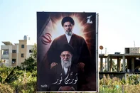 A photograph shows a billboard depicting Irans slain supreme leader Ayatollah Ali Khamenei and his son, Iran's new supreme leader Ayatollah Mojtaba Khamenei, displayed at the entrance to the southern Lebanese coastal city of Tyre on March 10, 2026. Lebanon was drawn into the Middle East war last week when Iran-backed militant group Hezbollah attacked Israel in response to the killing of Iranian supreme leader Ayatollah Ali Khamenei during US-Israeli strikes. (Photo by Kawnat HAJU / AFP) / ATTENTION EDITORS: AFP COVERS THE WAR IN THE MIDDLE EAST THROUGH ITS EXTENSIVE REGIONAL NETWORK, INCLUDING BUREAUS IN TEHRAN, JERUSALEM, AND SEVERAL NEIGHBORING COUNTRIES. SINCE THE START OF THE CONFLICT, JOURNALISTS HAVE BEEN WORKING UNDER INCREASINGLY RESTRICTIVE CONDITIONS. AUTHORITIES IN SEVERAL COUNTRIES HAVE LIMITED REPORTERS' MOVEMENTS, PHOTO AND LIVE VIDEO COVERAGE FROM SENSITIVE LOCATIONS. SOME GOVERNMENTS AND ARMED GROUPS HAVE BANNED IMAGES OF MISSILE OR DRONE STRIKES AND OTHER SECURITY-RELATED SITES. / <!-- NICAID(16242392) -->