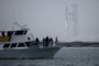 Spectator off South Padre Island, Texas, wait for the launch of the SpaceX Starship (L, rear) for a flight test from Starbase in Boca Chica, Texas, on April 20, 2023. - SpaceX is making a second attempt to carry out the first test flight of Starship, the most powerful rocket ever built, designed to send astronauts to the Moon, Mars and beyond. (Photo by Patrick T. Fallon / AFP)Editoria: SCILocal: South Padre IslandIndexador: PATRICK T. FALLONSecao: space programmeFonte: AFPFotógrafo: STF<!-- NICAID(15407783) -->