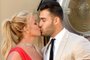 (FILES) US singer Britney Spears (L) and boyfriend Sam Asghari arrive for the premiere of Sony Pictures' "Once Upon a Time... in Hollywood" at the TCL Chinese Theatre in Hollywood, California on July 22, 2019. Spears and her model husband Asghari are heading for a divorce after 14 months of marriage, US media reported -- the latest personal crisis for the troubled pop star. Asghari, 29, filed divorce papers noting "irreconcilable differences" in their relationship, US entertainment media said on August 16, 2023, citing "multiple sources." The couple was married in 2022. (Photo by Matt Winkelmeyer / GETTY IMAGES NORTH AMERICA / AFP)Editoria: ACELocal: HollywoodIndexador: MATT WINKELMEYERSecao: celebrityFonte: GETTY IMAGES NORTH AMERICAFotógrafo: STR<!-- NICAID(15513094) -->