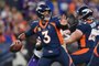 DENVER, COLORADO - NOVEMBER 19: Quarterback Russell Wilson #3 of the Denver Broncos throws a deep pass during the second quarter of the NFL game against the Minnesota Vikings at Empower Field At Mile High on November 19, 2023 in Denver, Colorado.   Dustin Bradford/Getty Images/AFP (Photo by Dustin Bradford / GETTY IMAGES NORTH AMERICA / Getty Images via AFP)<!-- NICAID(15604567) -->