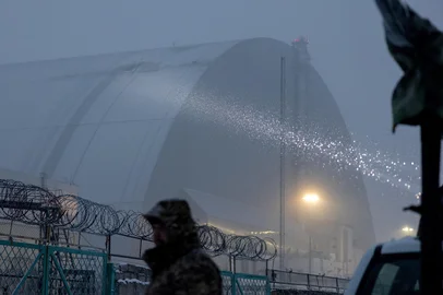 (FILES) This photo shows the damaged containment vessel at the New Safe Confinement (NSC), which protects the remains of reactor 4 of the former Chernobyl Nuclear Power Plant to contain radiation, following a drone attack, in Chernobyl, on February 14, 2025, amid the Russian invasion of Ukraine. The International Atomic Energy Agency (IAEA) announced on December 7, 2025 that its teams had been in Ukraine since early December to assess nuclear safety and had found that the Chernobyl arch had lost its primary safety functions following bombing in February 2025. (Photo by Tetiana DZHAFAROVA / AFP)<!-- NICAID(16181910) -->