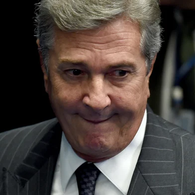 Brazilian Senator and former President (1990-1992) Fernando Collor de Mello gestures during the debate on suspending and impeaching President Dilma Rousseff in Brasilia on May 11, 2016. A simple majority in the 81-member Senate will trigger Rousseff's six-month suspension pending trial. A two-thirds majority would then be needed to remove her permanently. (Photo by EVARISTO SA / AFP)Editoria: POLLocal: BrasíliaIndexador: EVARISTO SASecao: politics (general)Fonte: AFPFotógrafo: STF<!-- NICAID(16024392) -->