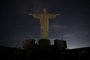 The Christ the Redeemer statue is seen without illumination to condemn racist acts against Brazilian footballer Vinicius Junior in Rio de Janeiro, Brazil, on May 22, 2023. The world-famous landmark had its illumination turned off for one hour in solidarity with Real Madrid's player Vinicius Junior, who was the target of persistent racist abuse during his teams 1-0 defeat to Valencia at the Mestalla Stadium in Spains La Liga on May 21, 2023. The act was described "as a symbol of the collective struggle against racism and in solidarity with the player and all those who suffer prejudice around the world." (Photo by CARLOS FABAL / AFP)<!-- NICAID(15435581) -->