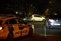 A car is seen behind police cordon after a suspected corrosive substance attack in south London on February 1, 2024. UK police were hunting a man who threw a suspected corrosive substance at a woman and two young children in south London. The victims were taken to hospital along with three members of the public who are believed to have been injured when they went to their aid. (Photo by HENRY NICHOLLS / AFP)<!-- NICAID(15666679) -->