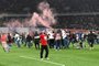 Georgia fans invade the pitch after their team won the UEFA EURO 2024 qualifying play-off final football match between Georgia and Greece in Tbilisi on March 26, 2024. (Photo by Vano SHLAMOV / AFP)Editoria: SPOLocal: TbilisiIndexador: VANO SHLAMOVSecao: soccerFonte: AFPFotógrafo: STR<!-- NICAID(15717311) -->