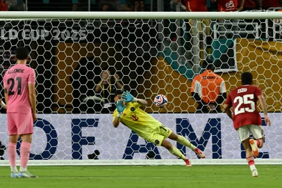 Inter Miami's Argentine goalkeeper #19 Oscar Ustari makes a save on a penalty kick by Al Ahly's Egyptian midfielder #07 Trezeguet during the Club World Cup 2025 Group A football match between Egypt's Al-Ahly and US Inter Miami at the Hard Rock stadium in Miami on June 14, 2025. (Photo by CHANDAN KHANNA / AFP)<!-- NICAID(16059924) -->
