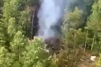 This video grab from a handout footage released by the Eastern Interregional Directorate for Transport of the Russian Investigative Committee on July 24, 2025, shows an aerial view of the crash site of the Antonov AN-24 passenger plane outside the town of Tynda in Russia's far eastern Amur region. A passenger plane carrying 49 people crashed in Russia's far eastern region of Amur on July 24, 2025, authorities said. (Photo by Handout / Investigative Committee of Russia / AFP) / RESTRICTED TO EDITORIAL USE - MANDATORY CREDIT "AFP PHOTO / INVESTIGATIVE COMMITTEE OF RUSSIA" - HANDOUT - NO MARKETING NO ADVERTISING CAMPAIGNS - DISTRIBUTED AS A SERVICE TO CLIENTS