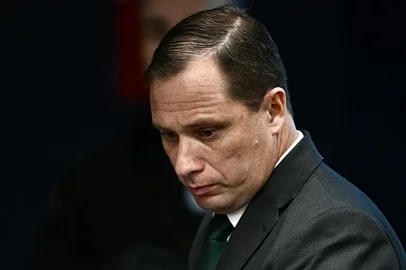 Brazil's Army Lieutenant Colonel Mauro Cid, aide-de-camp to former President Jair Bolsonaro, looks on during a session of the Brazilian Supreme Court judging the participation of those accused of the attempted coup d'état in January 2023, in Brasilia on June 9, 2025. The defendants in the coup trial of Brazil's far-right former president Jair Bolsonaro began testifying at the Supreme Court on Monday. Bolsonaro, who governed Brazil from 2019 to 2022, will take the stand along with seven co-accused on charges of plotting to overturn the results of the 2022 elections that Bolsonaro lost to leftist President Luiz Inacio Lula da Silva.  (Photo by EVARISTO SA / AFP)Editoria: POLLocal: BrasíliaIndexador: EVARISTO SASecao: coup d'etatFonte: AFPFotógrafo: STF<!-- NICAID(16157311) -->