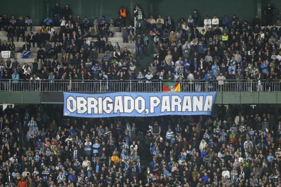A banner reading "Thanks, Parana" hangs from a stand during the Copa Libertadores group stage second leg football match between Brazil's Gremio and Bolivia's The Strongest at the Couto Pereira stadium in Curitiba, Brazil, on May 29, 2024. (Photo by Albari Rosa / AFP)Editoria: SPOLocal: CuritibaIndexador: ALBARI ROSASecao: soccerFonte: AFPFotógrafo: STR<!-- NICAID(15777057) -->