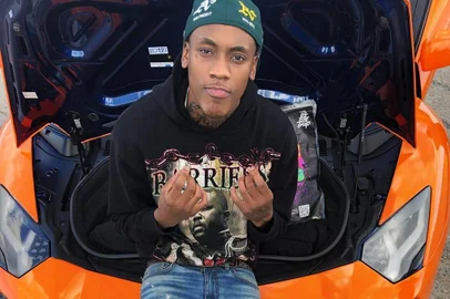 TDott Woo foi assassinado a tiros logo após assinar contrato com a gravadora Million Dollar Music.<!-- NICAID(15007206) -->