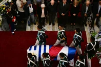 Uruguayan Blandengues (Parliament National Guard) carry the casket with the remains of Uruguay's former President Jose 'Pepe' Mujica, while leaving the Palacio Legislativo in Montevideo, on May 15, 2025. For a second day, thousands of Uruguayans lined up to bid farewell to deceased former leader Jose "Pepe" Mujica, who lost a year-long battle against cancer on May 13, 2025. The 89-year-old erstwhile leftist guerrilla, who spent a dozen years behind bars for revolutionary activity, was famed for his humility and once known as the "world's poorest president". (Photo by Pablo PORCIUNCULA / AFP)<!-- NICAID(16038365) -->