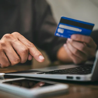 Businessman holding credit card and typing on laptop for online shopping and payment makes a purchase on the Internet, Online payment, Business financial and technology.<!-- NICAID(16330360) -->