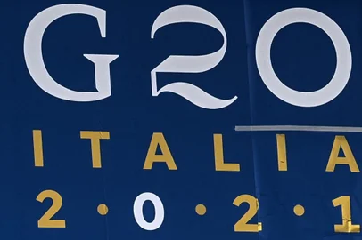 A panel on the facade of the convention center "La Nuvola" shows the logo of the upcoming G20 summit, on October 27, 2021 in the EUR district of Rome, where the upcoming October 30-31 G20 summit of heads of states will be held. (Photo by ANDREAS SOLARO / AFP)<!-- NICAID(14926672) -->