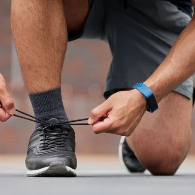 Person hands, sports and tie shoes for running workout, training and action performance on ground outdoor. Closeup of athlete, runner or lace sneakers for exercise, marathon or prepare cardio fitnessPerson hands, sports and tie shoes for running workout, training and action performance on ground outdoor. Closeup of athlete, runner or lace sneakers for exercise, marathon or prepare cardio fitness.Indexador: Yuri Arcurs peopleimages.comFonte: 629097916<!-- NICAID(15496236) -->