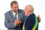 Brazil's new President Luiz Inacio Lula da Silva (R) greets Social Security Minister Carlos Lupi during the induction ceremony of the members of his cabinet, at Planalto Palace in Brasilia on January 1, 2023, after his inauguration ceremony. - Lula da Silva, a 77-year-old leftist who already served as president of Brazil from 2003 to 2010, took office for the third time with a grand inauguration in Brasilia. (Photo by Sergio LIMA / AFP)<!-- NICAID(15311833) -->