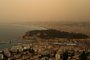 This photograph taken on March 30, 2024, shows thick sand dust blown in from the Sahara giving the sky a yellowish appearance above the French riviera city of Nice, southern France. This color is due to the sand blown from the Sahara desert and north Africa which has been coming up since March 27, 2024. (Photo by Valery HACHE / AFP)<!-- NICAID(15721156) -->