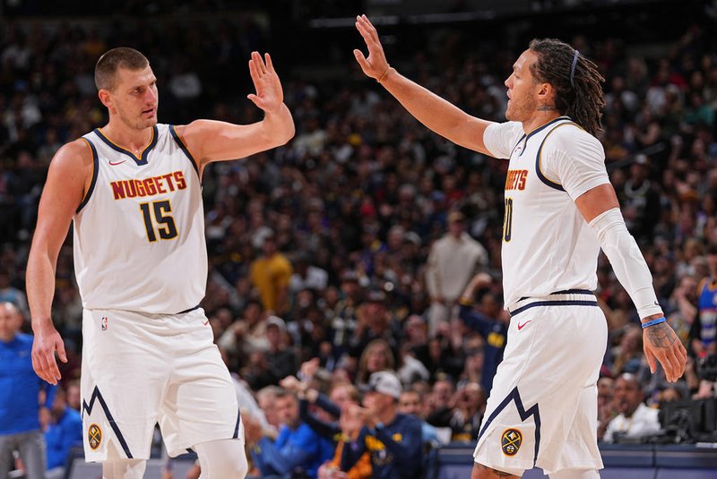 Chicago Bulls v Denver NuggetsDENVER, CO - OCTOBER 15: Nikola Jokic #15 and Aaron Gordon #50 of the Denver Nuggets high five during the game against the Chicago Bulls on October 15, 2023 at the Ball Arena in Denver, Colorado. NOTE TO USER: User expressly acknowledges and agrees that, by downloading and/or using this Photograph, user is consenting to the terms and conditions of the Getty Images License Agreement. Mandatory Copyright Notice: Copyright 2023 NBAE   Bart Young/NBAE via Getty Images/AFP (Photo by Bart Young / NBAE / Getty Images / Getty Images via AFP)Editoria: SPOLocal: DenverIndexador: BART YOUNGSecao: basketballFonte: NBAE / Getty ImagesFotógrafo: CONTRIBUTOR<!-- NICAID(15577466) -->