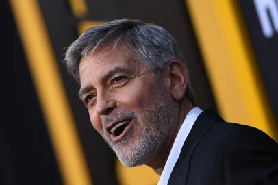 (FILES) In this file photo taken on May 07, 2019 US actor George Clooney arrives to the premiere of "Catch-22" at the TCL Chinese Theatre in Hollywood, California. - Hollywood star George Clooney will launch an academy for Los Angeles high school students as part of a new scheme to teach movie industry skills to children from disadvantaged and minority communities, it was announced June 21, 2021. (Photo by VALERIE MACON / AFP)<!-- NICAID(14814979) -->