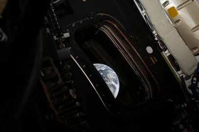 A view of Earth taken by NASA astronaut and Artemis II commander Reid Wiseman from one of the Orion spacecraft's four main windows after completing the translunar injection burn on April 2, 2026.<!-- NICAID(16258602) -->