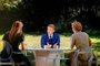 This photograph of a TV screen shows French President Emmanuel Macron answering French journalists and TV hosts Anne-Claire Coudray (L) and Caroline Roux (R) during a live broadcast interview on the Bastille Day, at the Elysee Palace in Paris on July, 14, 2022. (Photo by Ludovic MARIN / AFP)<!-- NICAID(15148988) -->
