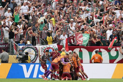 Fluminense players celebrate after scoring their third goal during the FIFA Club World Cup 2025 Group F football match between Brazil's Fluminense and South Korea's Ulsan HD at the MetLife stadium in East Rutherford, New Jersey on June 21, 2025. (Photo by CHARLY TRIBALLEAU / AFP)<!-- NICAID(16064838) -->