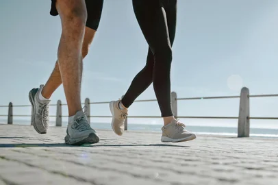 People, legs and running at the beach for exercise, cardio workout or training together outdoors. Leg of friends taking run, walk or jog on warm sunny day by the ocean coast for healthy wellnessPeople, legs and running at the beach for exercise, cardio workout or training together outdoors. Leg of friends taking run, walk or jog on warm sunny day by the ocean coast for healthy wellness.Indexador: Yuri Arcurs peopleimages.comFonte: 570499402<!-- NICAID(15828946) -->