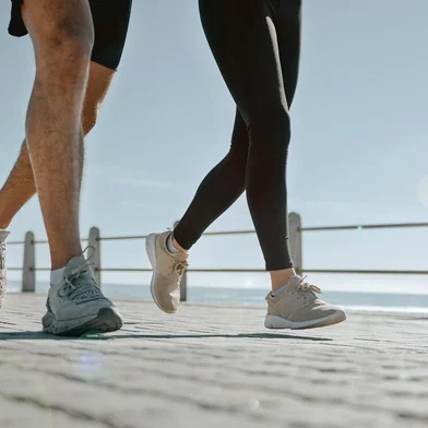 People, legs and running at the beach for exercise, cardio workout or training together outdoors. Leg of friends taking run, walk or jog on warm sunny day by the ocean coast for healthy wellnessPeople, legs and running at the beach for exercise, cardio workout or training together outdoors. Leg of friends taking run, walk or jog on warm sunny day by the ocean coast for healthy wellness.Indexador: Yuri Arcurs peopleimages.comFonte: 570499402<!-- NICAID(15828946) -->
