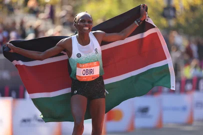 Hellen Obiri of Kenya celebrates winning the New York Marathon in New York on November 2, 2025. (Photo by CHARLY TRIBALLEAU / AFP)<!-- NICAID(16158837) -->
