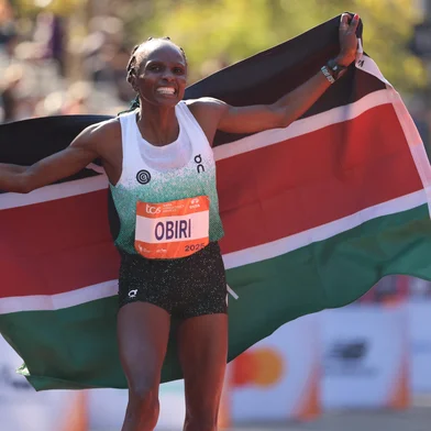 Hellen Obiri of Kenya celebrates winning the New York Marathon in New York on November 2, 2025. (Photo by CHARLY TRIBALLEAU / AFP)<!-- NICAID(16158837) -->