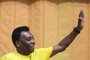 (FILES) In this file photo taken on December 04, 2013, Brazilian former football star Pele waves during an activity to promote healthy living and lifestyle among children, in Sao Paulo, Brazil. - Brazil started three days of national mourning on December 30, 2022, for football legend Pele, the three-time World Cup winner widely regarded as the greatest player of all time, who has died at the age of 82. (Photo by Miguel Schincariol / AFP)<!-- NICAID(15309283) -->