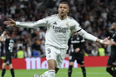Real Madrid's French forward #09 Kylian Mbappe celebrates after converting a penalty to score their first goal during the Spanish league football match between Real Madrid CF and Club Deportivo Leganes SAD at the Santiago Bernabeu stadium in Madrid on March 29, 2025. (Photo by Thomas COEX / AFP)<!-- NICAID(16006184) -->